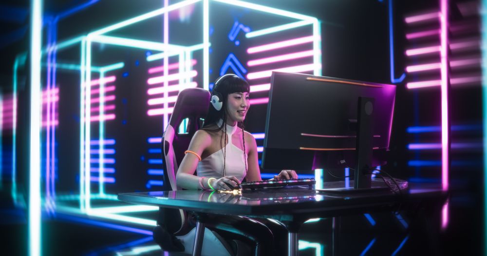 Japanese Female Gamer Playing Online Video Game on Computer.