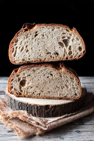 Slices of fresh bread falling on table