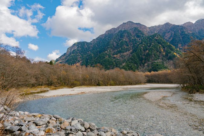 landscape view of japan alps mountain with natural forest, blue river on autumn season at kamikochi Nagano.