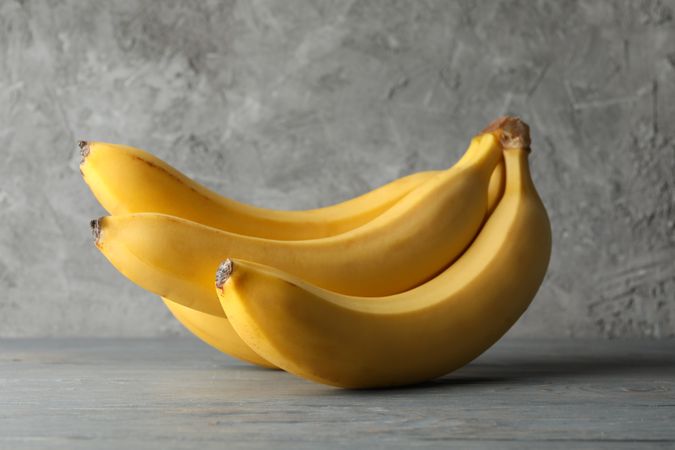 Bananas on wooden gray background. Fresh fruit