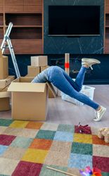 Woman inside a box preparing the move