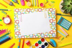 Flat lay composition with school supplies on color background, space for text