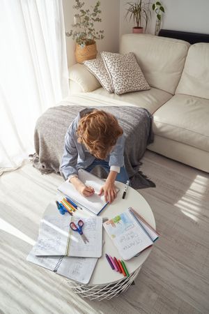 Little schoolboy on creative pastime