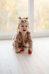 Baby girl crawling on floor