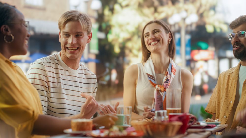 Young Women and Men Having Fun and Joyful Conversations.
