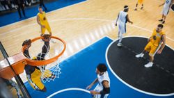 Cinematic College Basketball Tournament: Two Young Successful Diverse Teams Play a Championship Match in a Modern Arena.