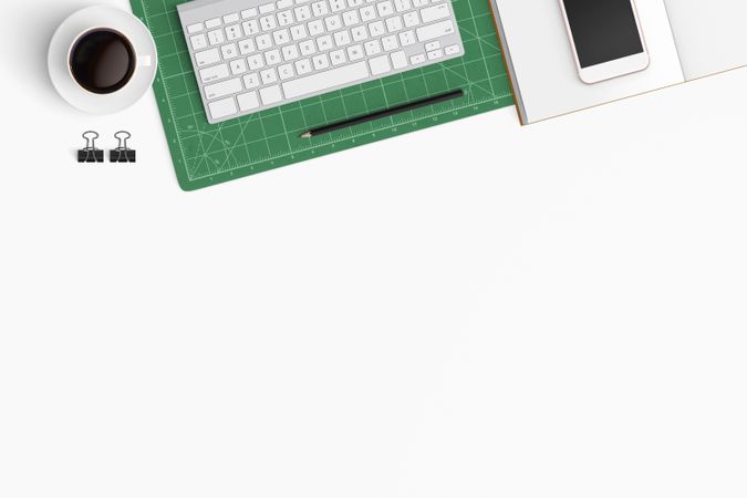 Modern workspace with coffee cup, smartphone, paper, notebook, tablet and laptop copy space
