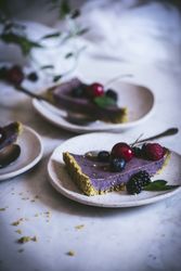 Blueberry pistachio sliced cake with whole berries on top