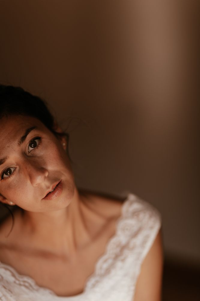 woman sitting in dark room