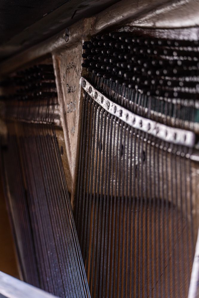 Old destroyed piano instrument close up