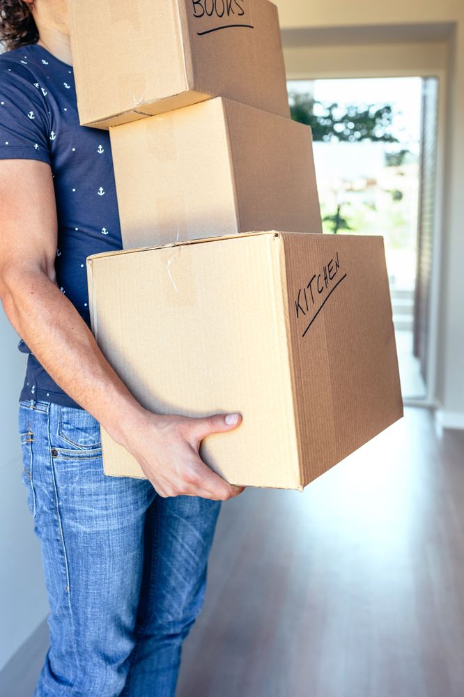 Man carrying moving boxes