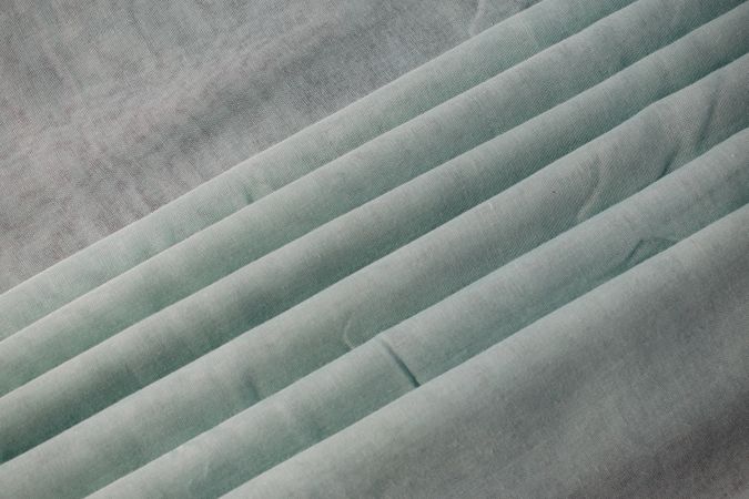 Nude green fabric folded background texture