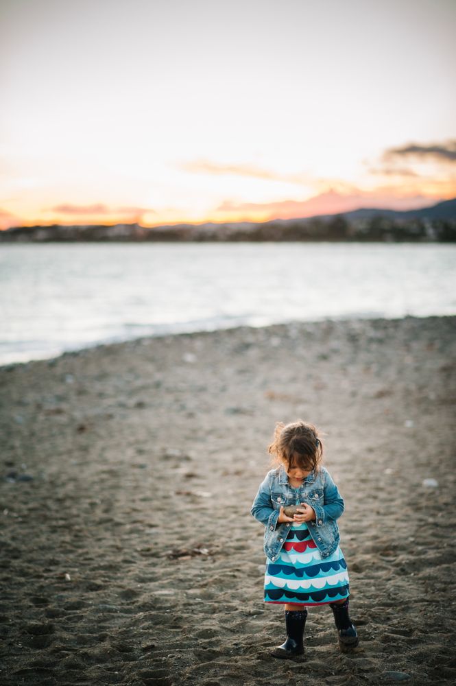 girl with stones at beach