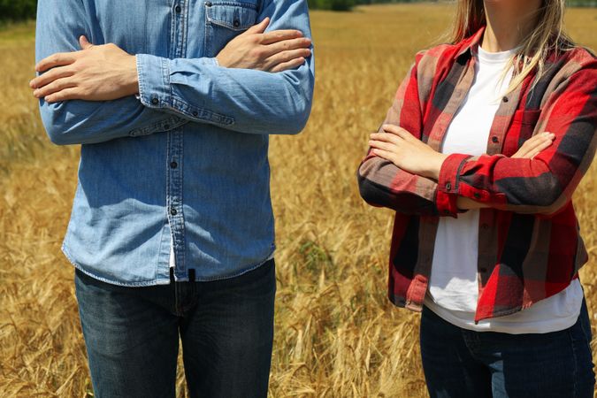 Young man and woman in barley field. Agriculture business