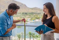 Safety inspectors checking balcony railing