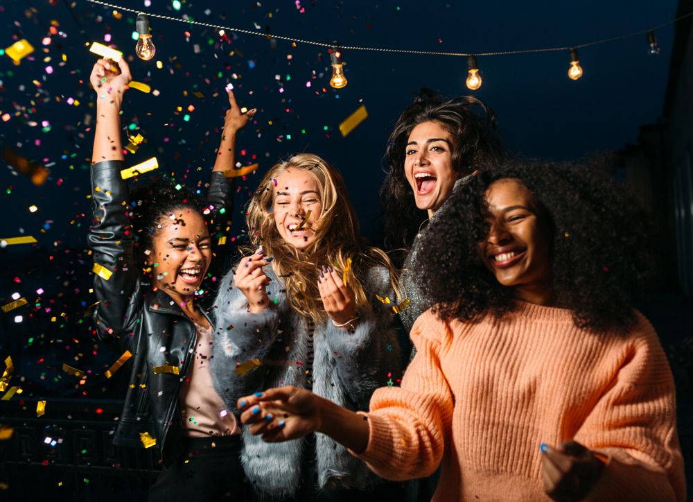 Multi-ethnic group of women at a fun party outside