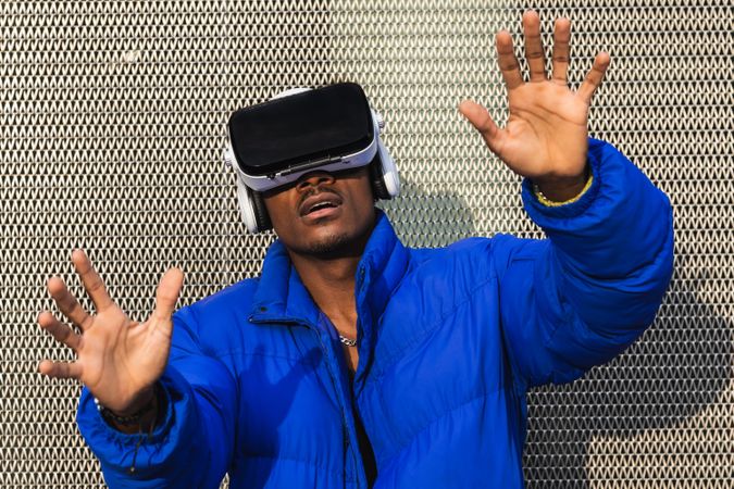 Black man experiencing virtual reality in city