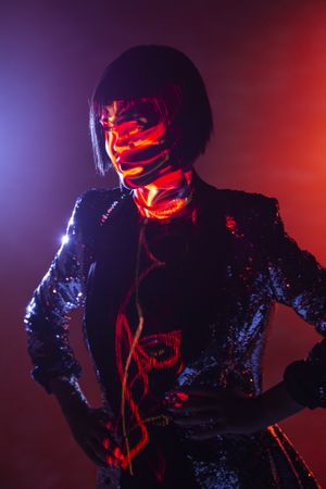 Stylish woman singing on stage