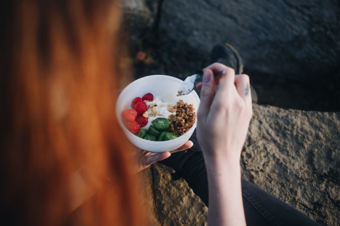 Yogurt breakfast bowl enjoyed outdoors