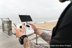 Man with remote for drone camera 0gPPe5