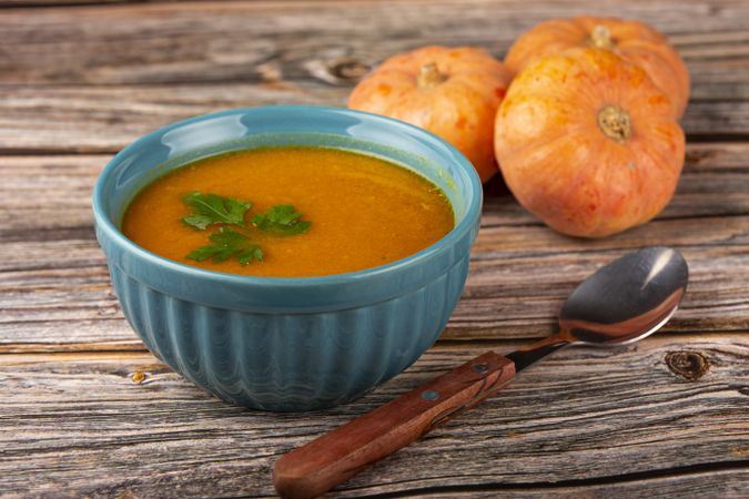 Delicious homemade pumpkin soup in bowl.