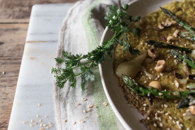 Served vegetarian crepe with oats and asparagus