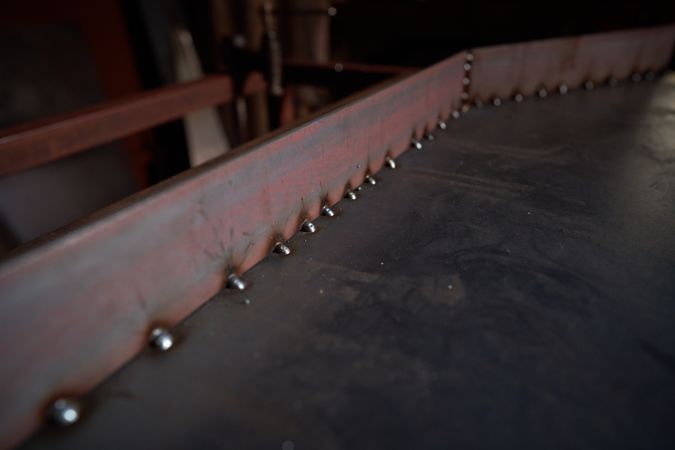 Welded metal detail on table