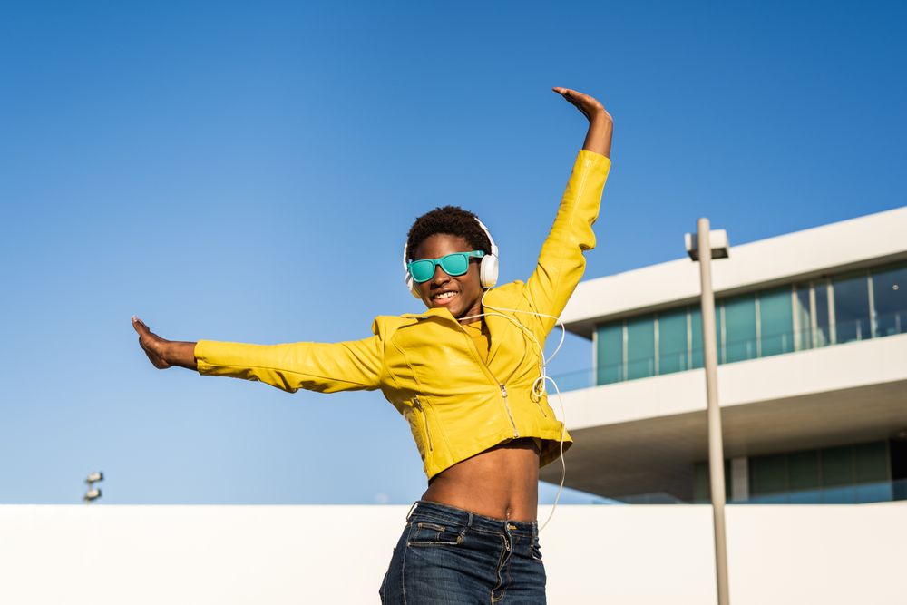 Joyful female smiling and jumping