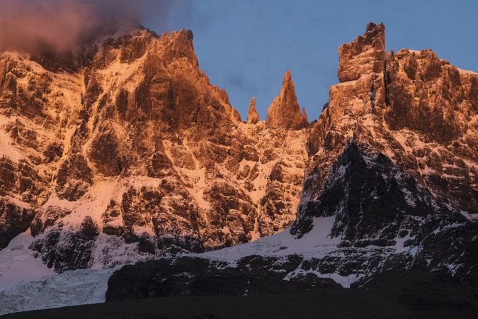 Mountain peaks covered by snow in warn sun light