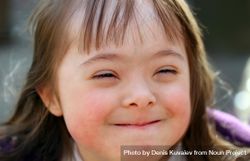 Portrait of young girl with Down syndrome outside on a cold day 5z7yX4