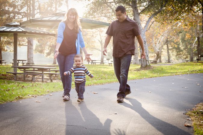 Happy Family Walking In The Park