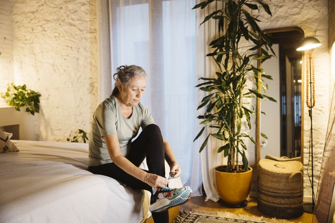 Mature woman getting ready for running