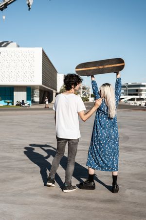 Couple standing near modern building