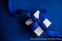 Valentine present with blue ribbon on blue table 4NEEYm