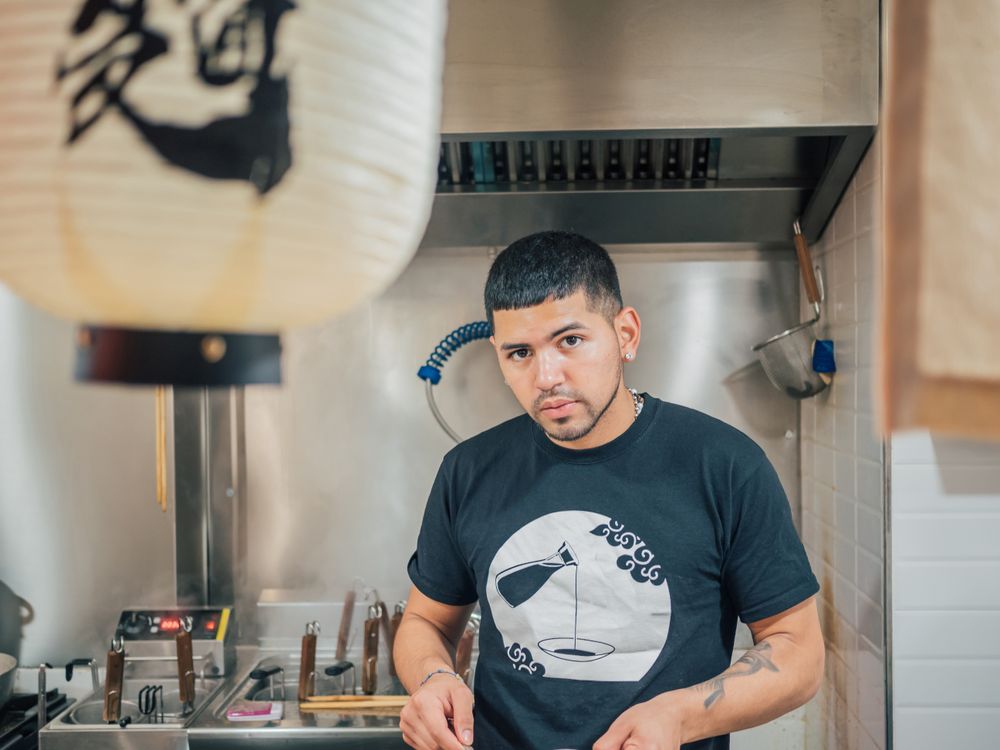 Handsome male cooking in kitchen