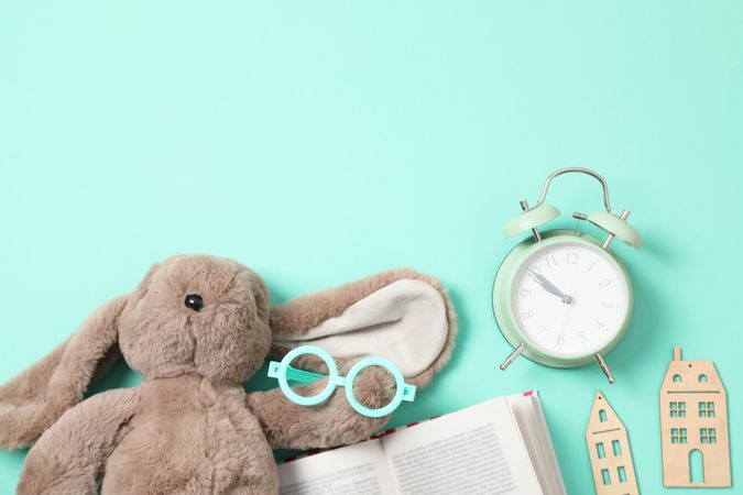 A children's book with toys on a light background.