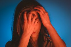 woman touching her hair