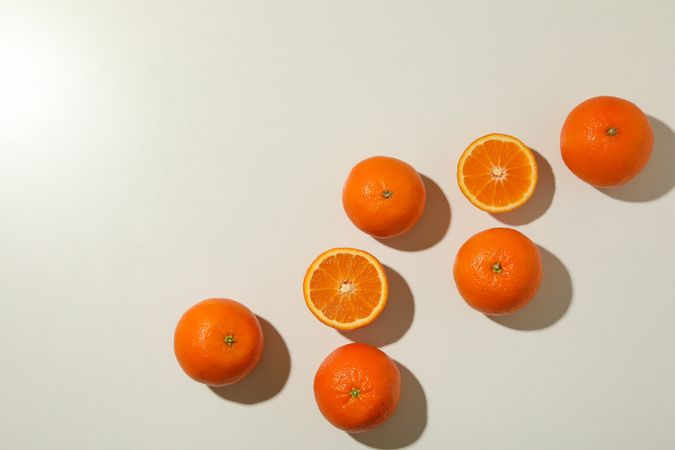 Ripe sweet mandarins on light background, top view