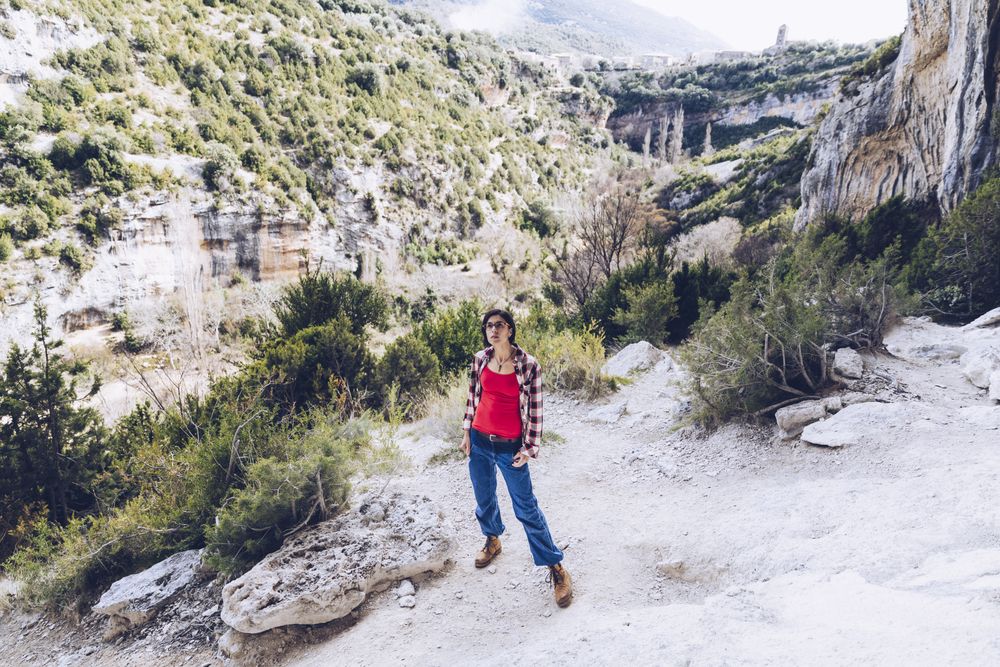 Female traveler in mountainous terrain