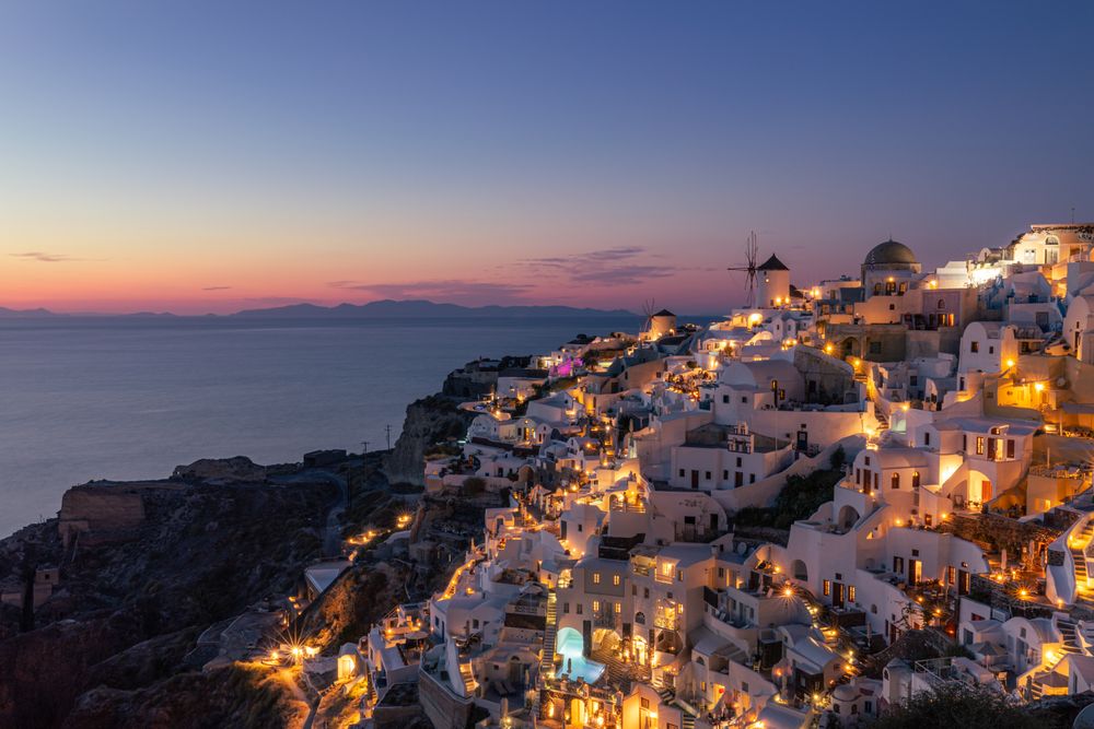 Buildings lighting up at sun down on the Greek island of Santorini
