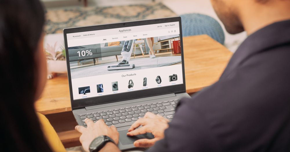 Young Couple Using Laptop to Buy Appliances From the Comfort of Their Home