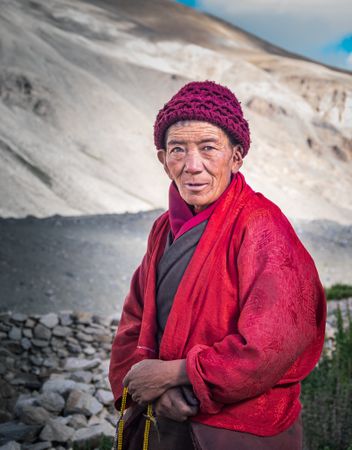 Tibet - August, 29 2014: Older Tibetan man in mountainous region