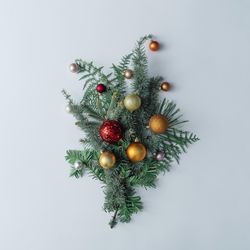 Winter branches arranged with Christmas bauble decorations