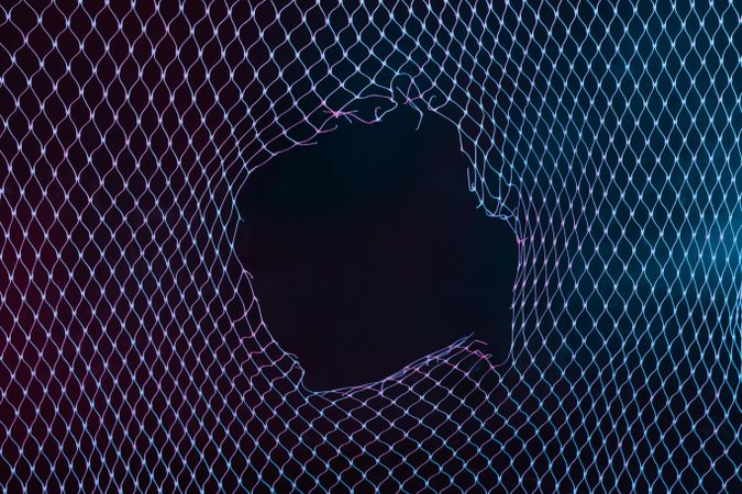 Abstract mesh net background with colorful ultraviolet holographic neon lights