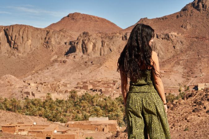 Woman between desert near mountains