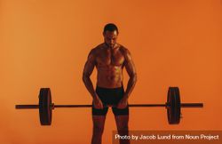 Weight lifting man working out using barbell 5nxVlb