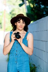 Transgender woman holding camera