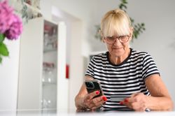Older woman buying online with credit card