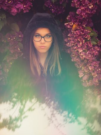 Woman on background of stunning violet flowers