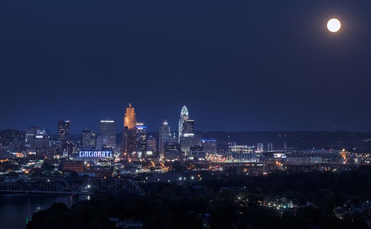 Dusk view of the city, with the giant, illuminated "CINCINNATI" sign, Cincinnati, Ohio